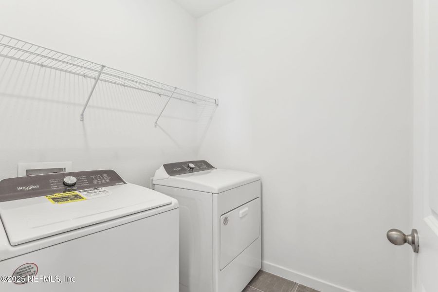 Furnished interior view inside a new home in Lakes at Bella Lago - Signature Series, Green Cove Springs (Image 8). Furnished interior view inside a new home in Lakes at Bella Lago - Signature Series, Green Cove Springs (Image 8).