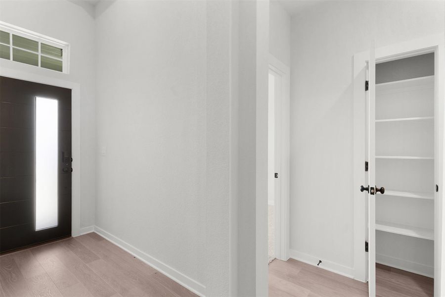 Foyer entrance with light wood finished floors Foyer entrance with light wood finished floors