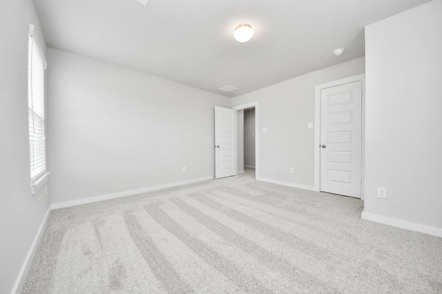 Generously sized secondary bedrooms featuring spacious closets, soft and inviting carpeting underfoot, large windows allowing plenty of natural light, and the added touch of privacy blinds for your personal retreat. Sample photo of completed home with similar floor plan. Actual colors and selections may vary. Generously sized secondary bedrooms featuring spacious closets, soft and inviting carpeting underfoot, large windows allowing plenty of natural light, and the added touch of privacy blinds for your personal retreat. Sample photo of completed home with similar floor plan. Actual colors and selections may vary.