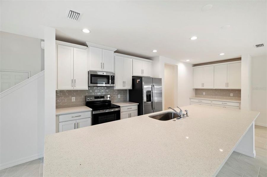 Furnished interior view inside a new home in Preservation Pointe, Davenport (Image 3). Furnished interior view inside a new home in Preservation Pointe, Davenport (Image 3).