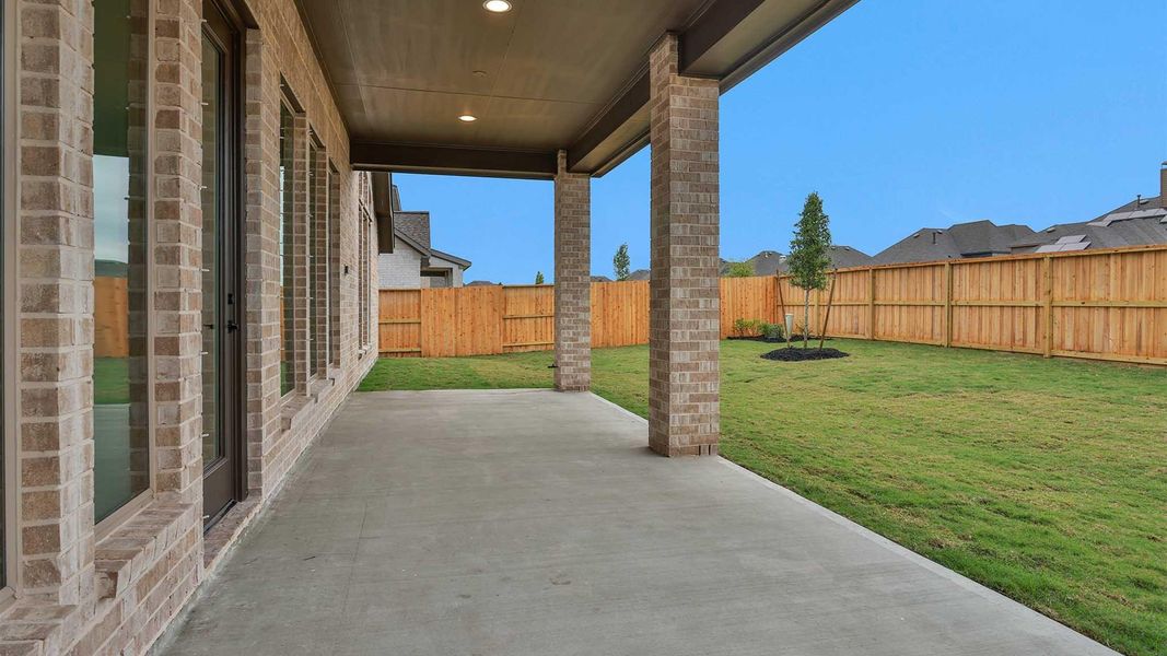 Exterior details and patio area of a home in Meridiana, Manvel (Image 3).