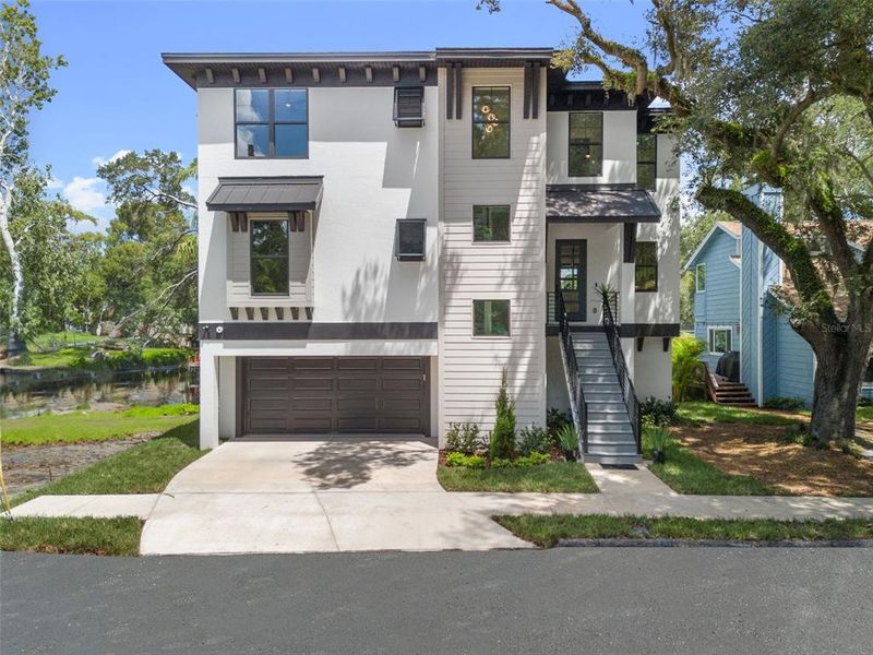 Front exterior of a new home in , Tampa, FL, highlighting curb appeal (Image 25).