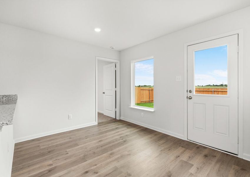 The dining room has large windows that let in great, natural light.