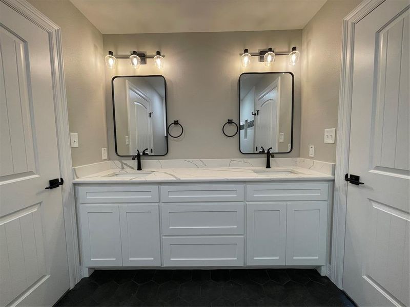 Bathroom with tile patterned flooring and vanity