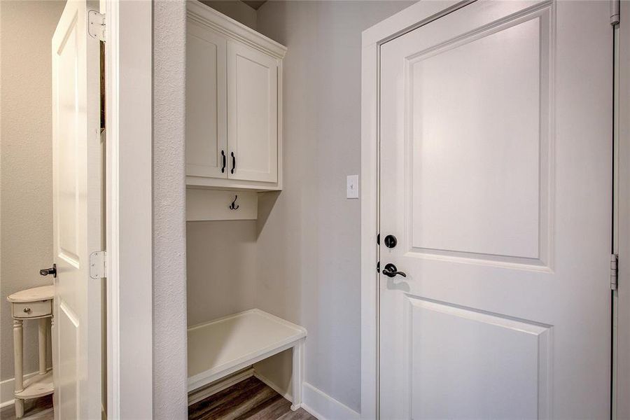 Mudroom featuring dark wood-type flooring