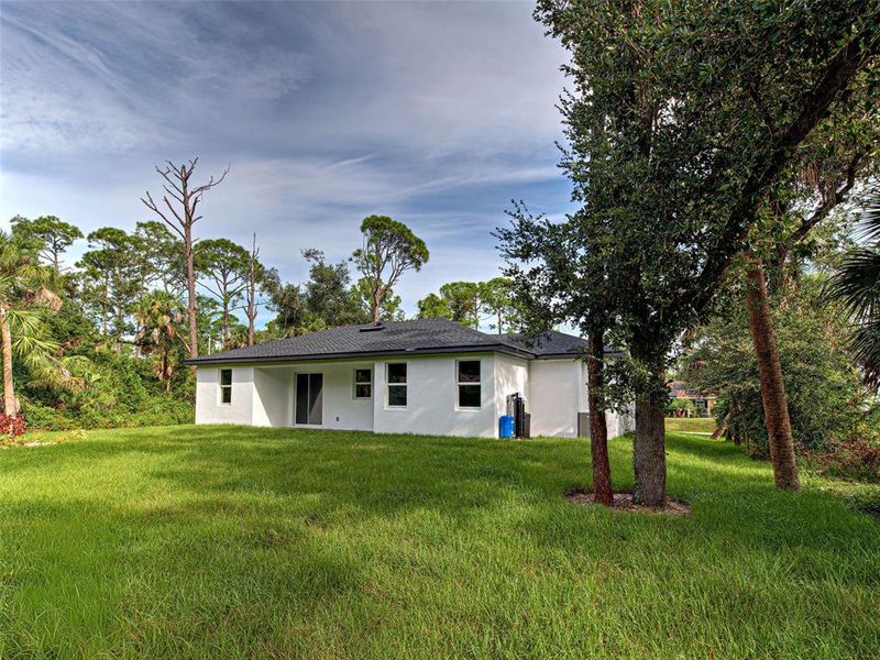 Front exterior of a new home in , Port Charlotte, FL, highlighting curb appeal (Image 24).