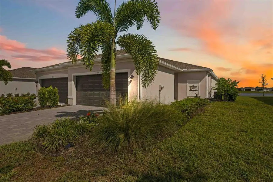 Front exterior of a new home in , Englewood, FL, highlighting curb appeal (Image 1). Front exterior of a new home in , Englewood, FL, highlighting curb appeal (Image 1).