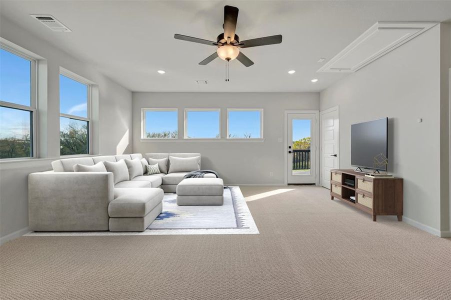 Living area with a ceiling fan, recessed lighting, and light colored carpet Living area with a ceiling fan, recessed lighting, and light colored carpet