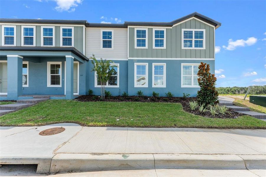 Front exterior of a new home in Eden Crest, Apopka, FL, highlighting curb appeal (Image 19). Front exterior of a new home in Eden Crest, Apopka, FL, highlighting curb appeal (Image 19).