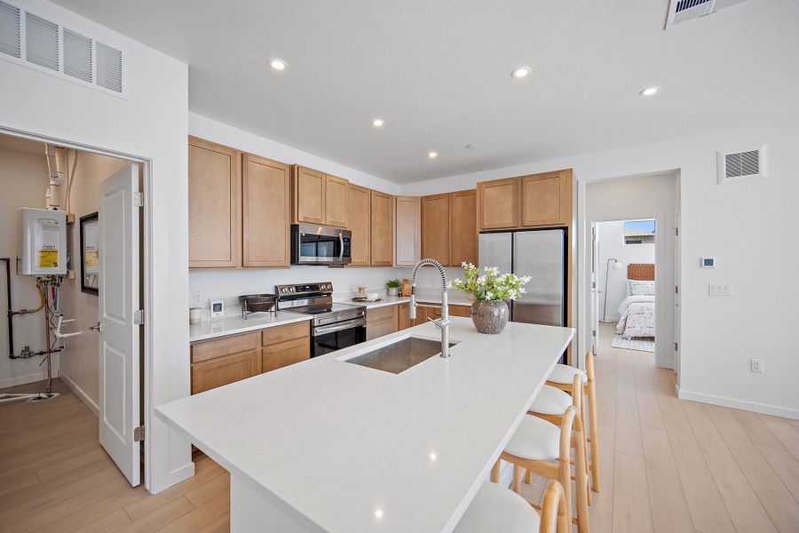 Furnished interior view inside a new home in Lyric at RidgeGate Condos, Lone Tree (Image 6).
