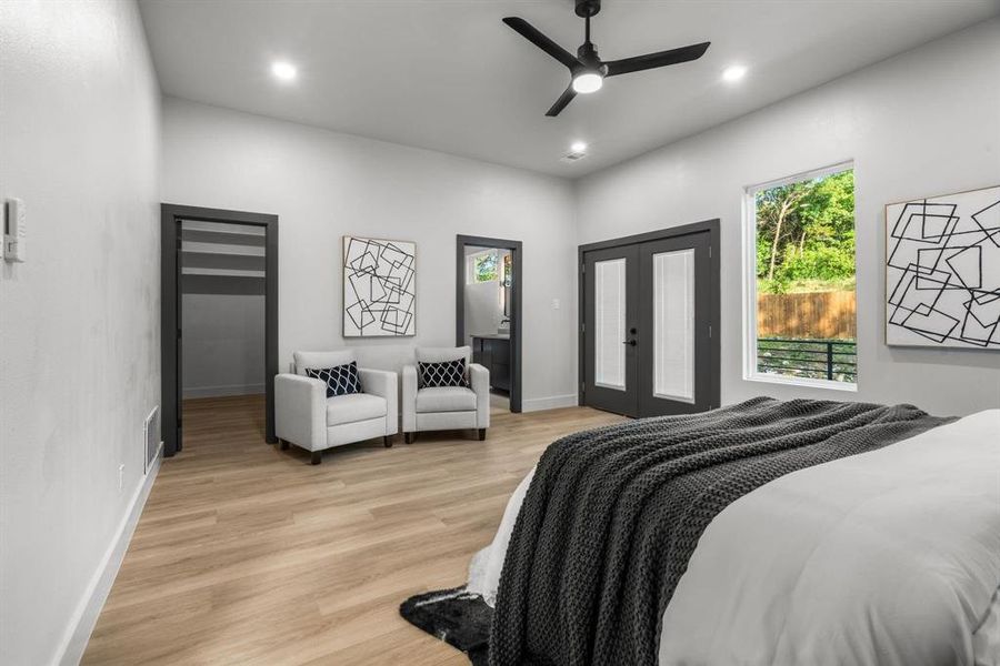 Bedroom with access to exterior, light wood finished floors, french doors, ceiling fan, and recessed lighting