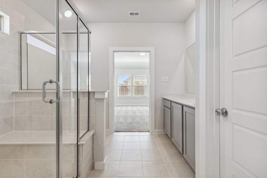 Primary bathroom in the Heisman home plan by Trophy Signature Homes – REPRESENTATIVE PHOTO