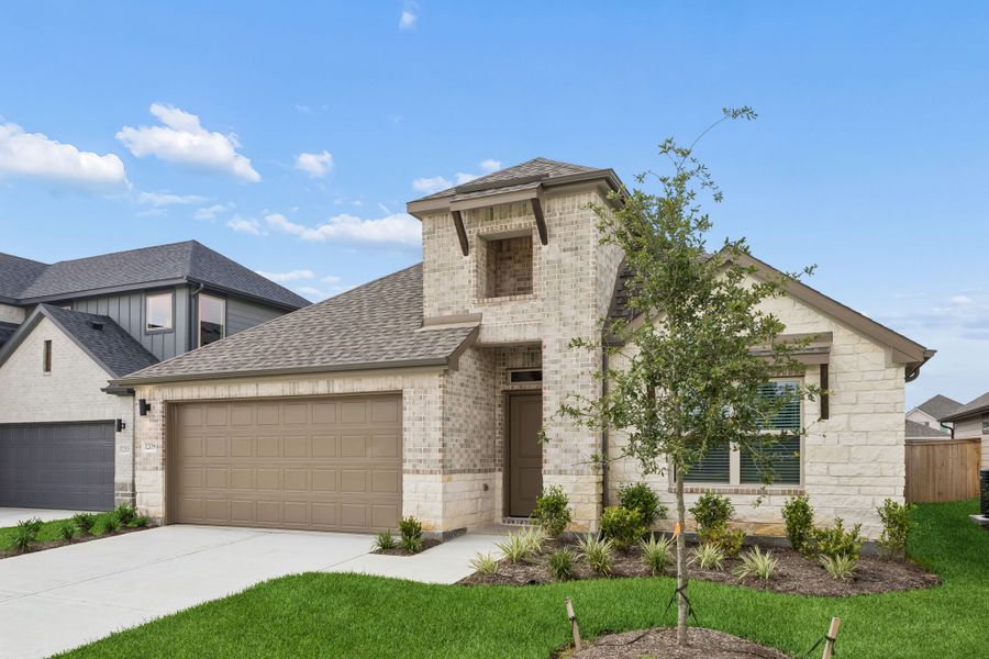 Front exterior of a new home in Riviera Pines, Huffman, TX, highlighting curb appeal (Image 2). Front exterior of a new home in Riviera Pines, Huffman, TX, highlighting curb appeal (Image 2).