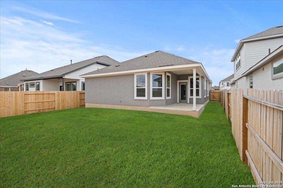 Front exterior of a new home in Meyer Ranch, New Braunfels, TX, highlighting curb appeal (Image 2).