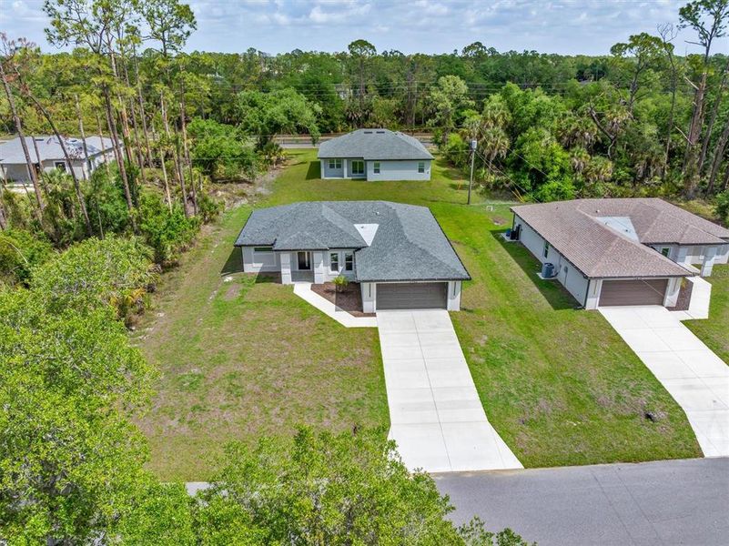 Front exterior of a new home in , Port Charlotte, FL, highlighting curb appeal (Image 12).
