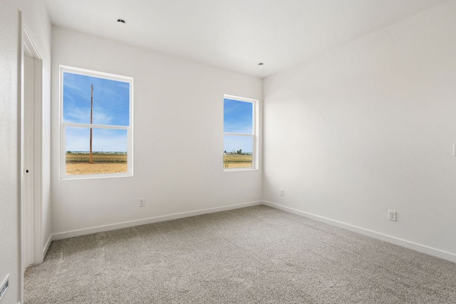 Spacious, unfurnished interior of a new home in Union Colony West, Greeley (Image 13).