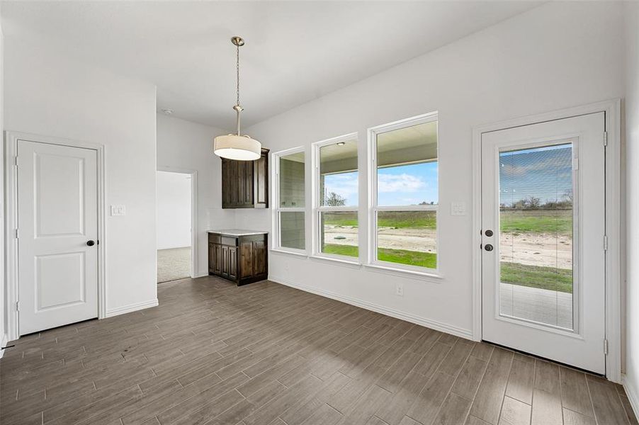 Unfurnished living room featuring hardwood / wood-style flooring