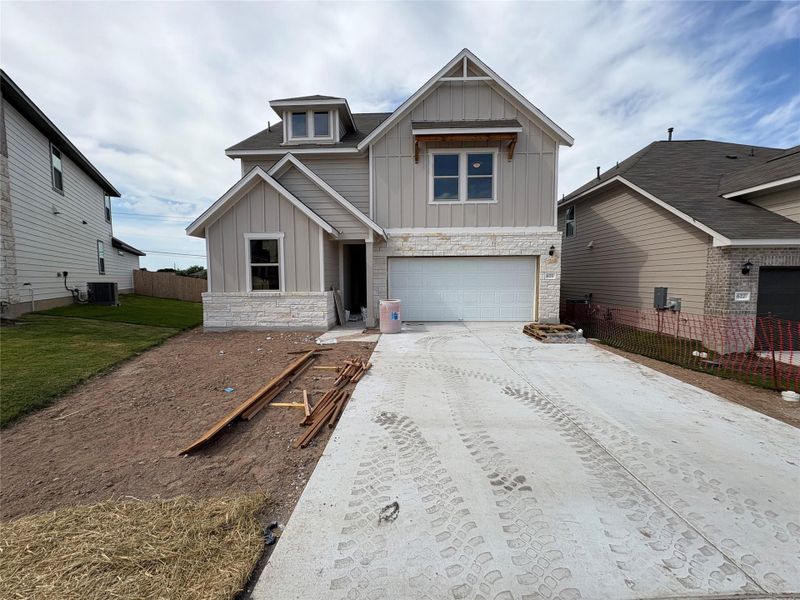 Front exterior of a new home in Covered Bridge, Hutto, TX, highlighting curb appeal (Image 21).