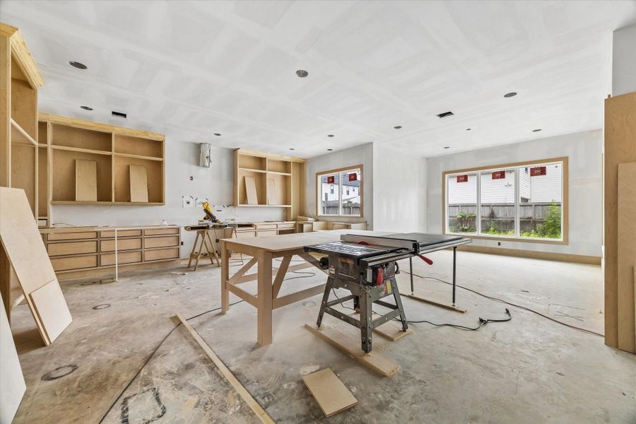 KITCHEN / DINING ROOM - View of kitchen and dining room. The dining room walls are lined with large windows. -- **Current construction as of 4/13/2026** KITCHEN / DINING ROOM - View of kitchen and dining room. The dining room walls are lined with large windows. -- **Current construction as of 4/13/2026**