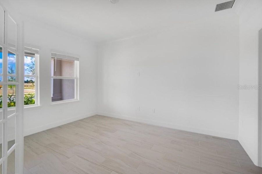 Spacious, unfurnished interior of a new home in Harvest at Ovation, Winter Garden (Image 36).