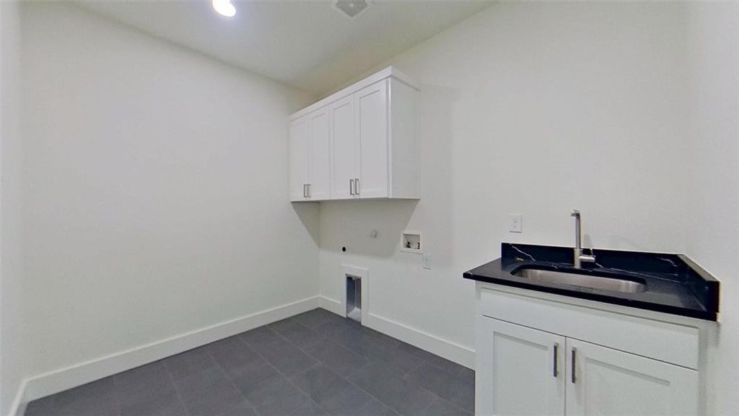 Laundry room featuring cabinet space, washer hookup, electric dryer hookup, hookup for a gas dryer, and recessed lighting