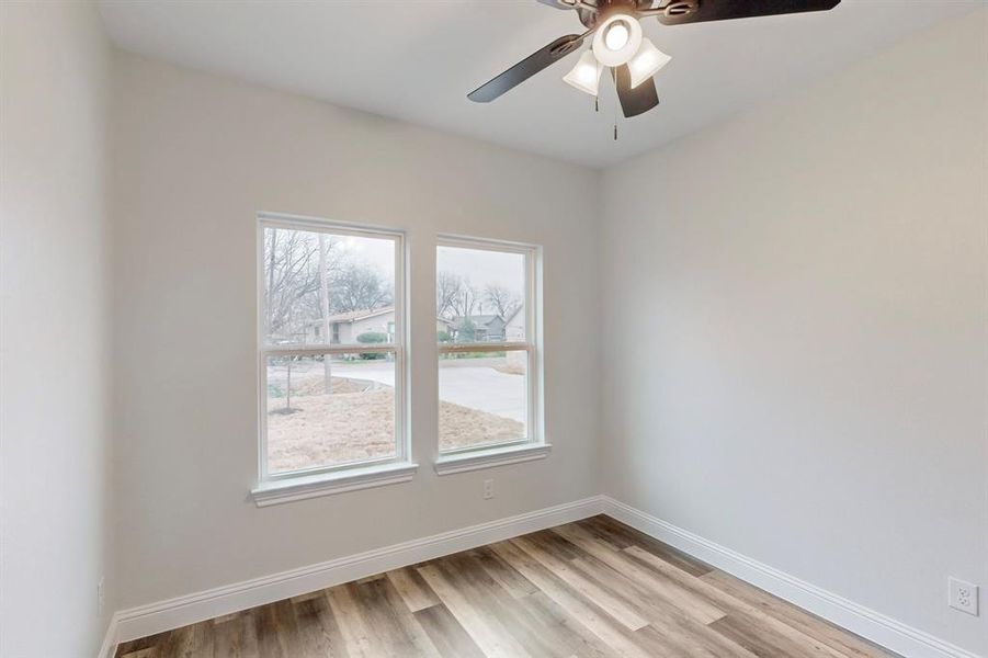 Empty room featuring light hardwood / wood-style floors and ceiling fan