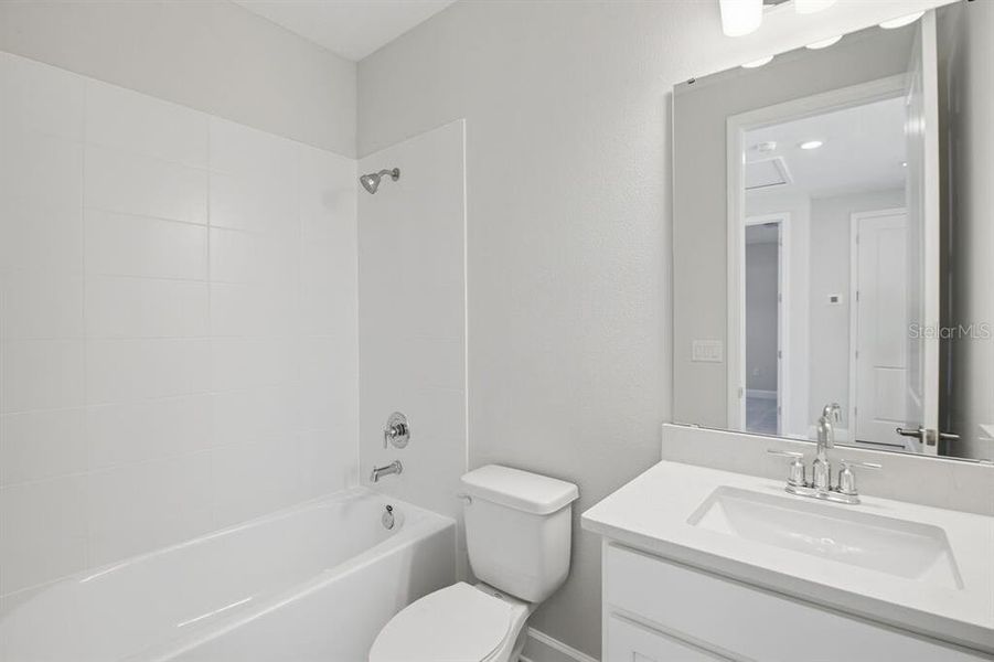 Furnished interior view inside a new home in Harvest at Ovation, Winter Garden (Image 8).