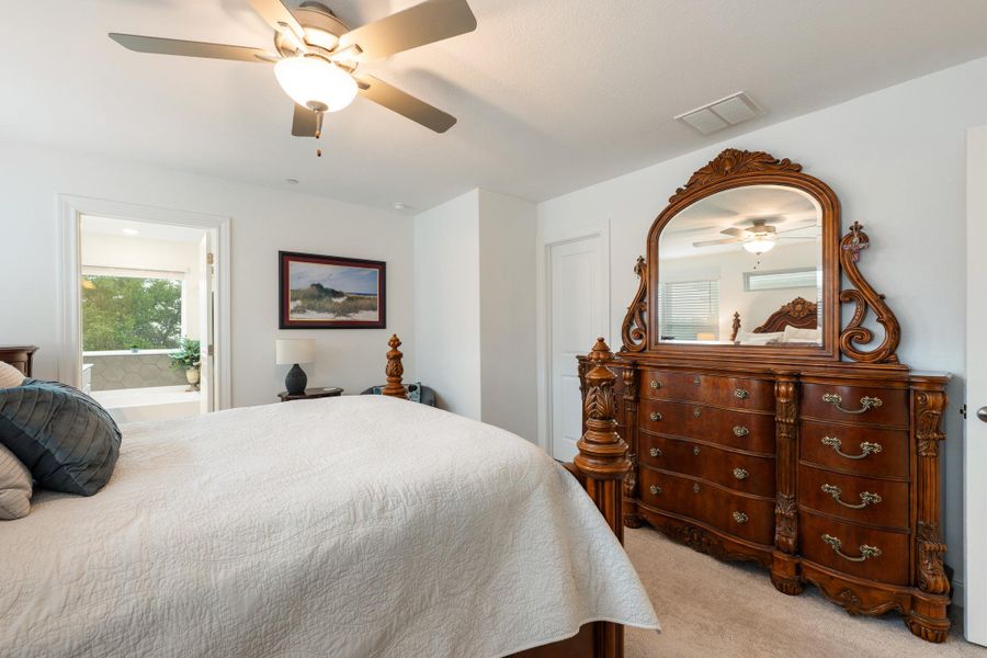 Relax in this tranquil sleeping area, complete with a ceiling fan for comfort and an en-suite bath with a generously sized soaking tub. Relax in this tranquil sleeping area, complete with a ceiling fan for comfort and an en-suite bath with a generously sized soaking tub.