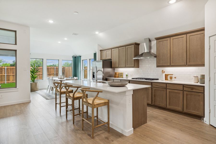 Kitchen in the Gilmour home plan by Trophy Signature Homes – REPRESENTATIVE PHOTO
