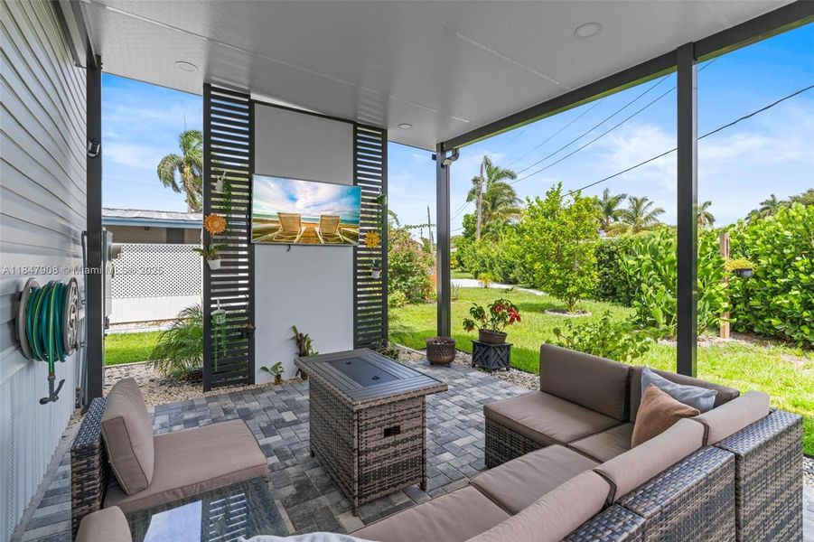 Covered Entertainment area/ TV included in sale