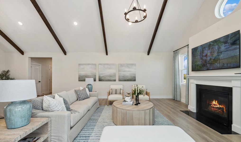 Great room with fireplace and stained ceiling beams