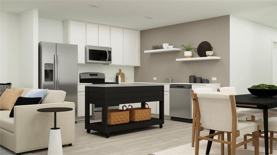 Kitchen featuring light wood-type flooring, appliances with stainless steel finishes, and white cabinets