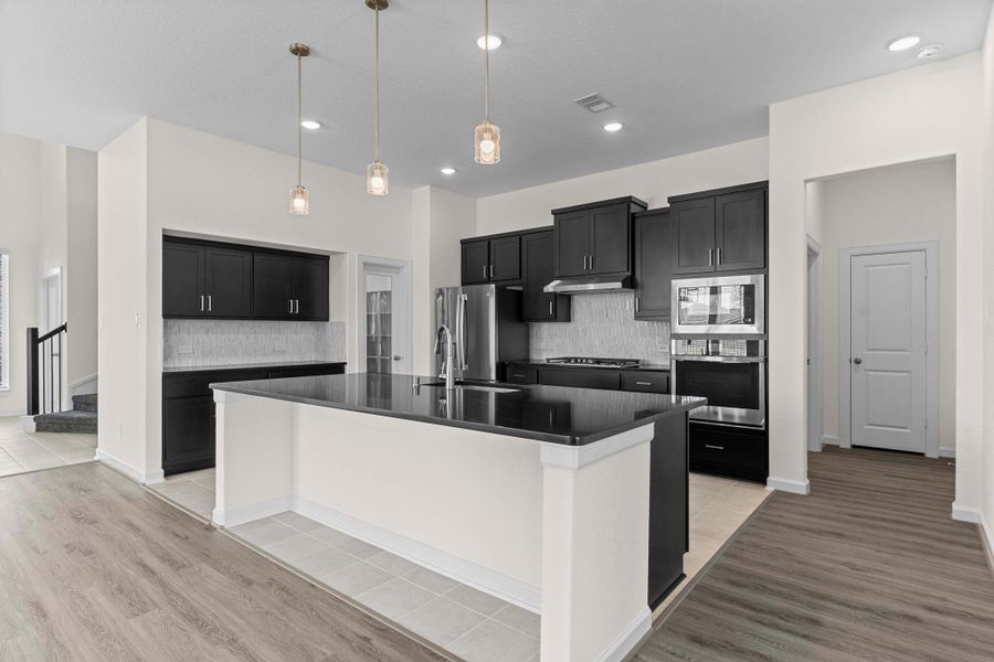 Wow, what a gourmet kitchen for that cook in the family! Large eat in working station island with beautiful granite countertops, Pendant lighting above and more! Notice the glass door to your left and discover the huge walk in pantry! Make that appointment and see this stunning new home by CastleRock Community! Wow, what a gourmet kitchen for that cook in the family! Large eat in working station island with beautiful granite countertops, Pendant lighting above and more! Notice the glass door to your left and discover the huge walk in pantry! Make that appointment and see this stunning new home by CastleRock Community!