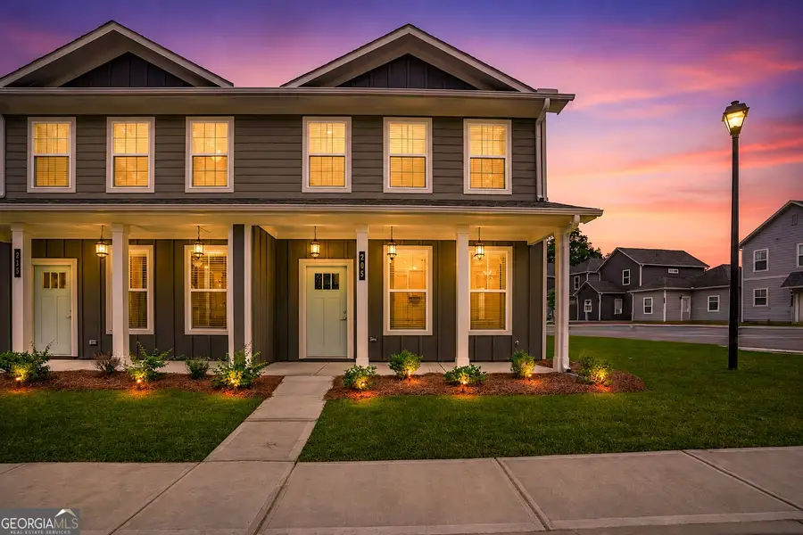 Front exterior of a new home in The Cottages at East Lanier, Fayetteville, GA, highlighting curb appeal (Image 1). Front exterior of a new home in The Cottages at East Lanier, Fayetteville, GA, highlighting curb appeal (Image 1).