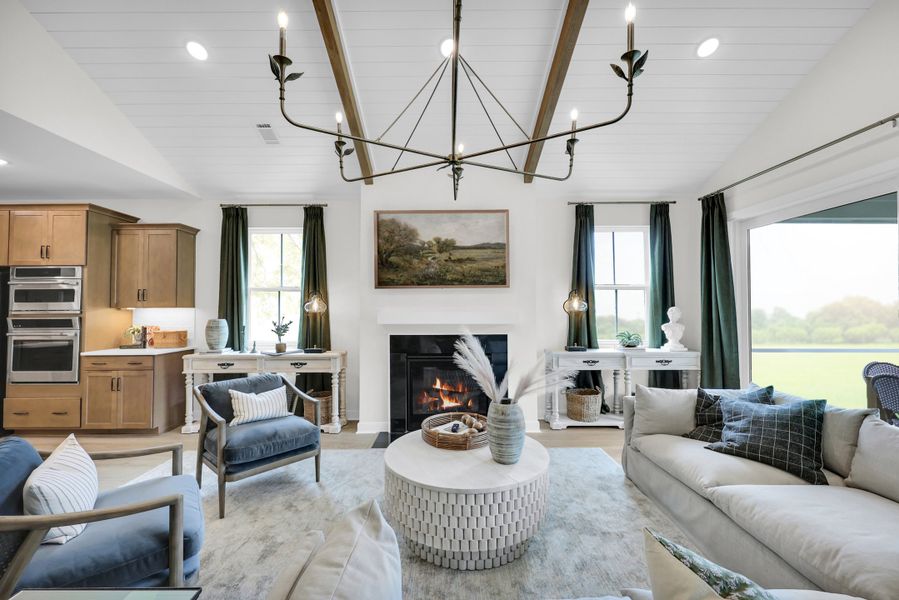 Great room with vaulted ceiling and ceiling beams Great room with vaulted ceiling and ceiling beams