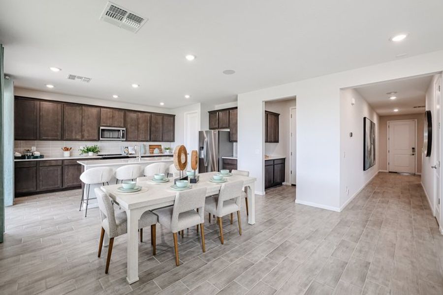 A kitchen with a dining table. A kitchen with a dining table.