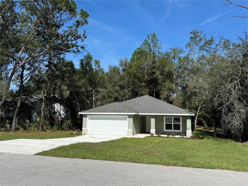 Front exterior of a new home in , Dunnellon, FL, highlighting curb appeal (Image 1). Front exterior of a new home in , Dunnellon, FL, highlighting curb appeal (Image 1).