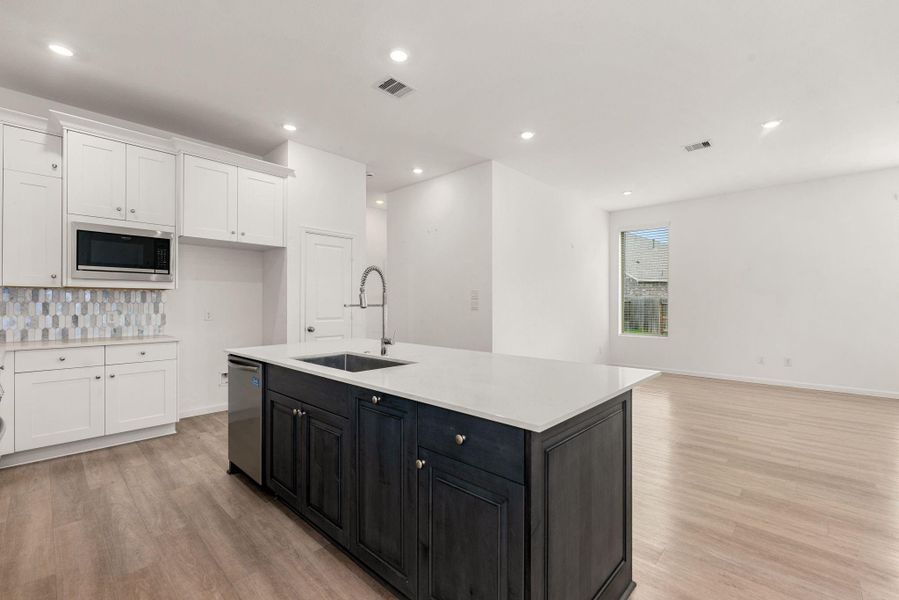 Furnished interior view inside a new home in Sunterra, Katy (Image 11).