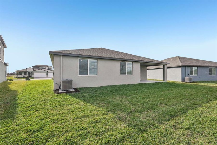 Exterior details and patio area of a home in Oakfield Trails - Signature Series, Parrish (Image 3).