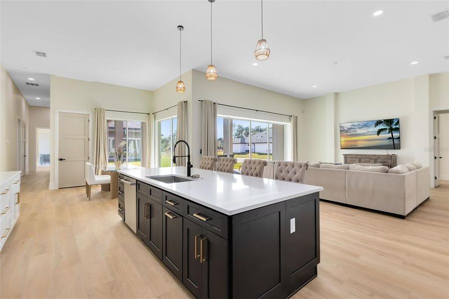 Great view of the kitchen, living room and dining area.