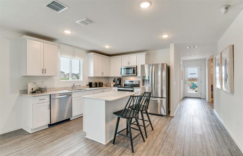 Spacious kitchen with eat-in bartop island