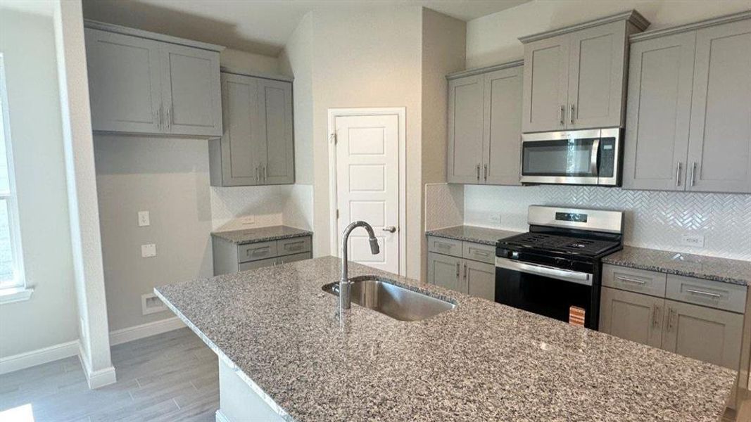 Kitchen - All Home and community information, including pricing, included features, terms, availability and amenities, are subject to change at any time without notice or obligation. All Drawings, pictures, photographs, video, square footages, floor plans, elevations, features, colors and sizes are approximate for illustration purposes only and will vary from the homes as built.