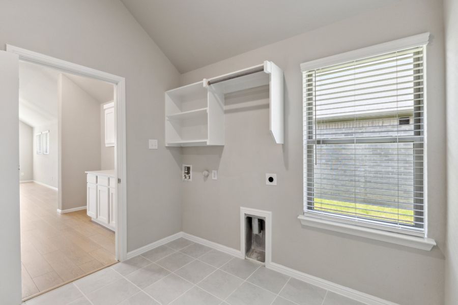 Utility Room in the Diamond home plan by Trophy Signature Homes – REPRESENTATIVE PHOTO