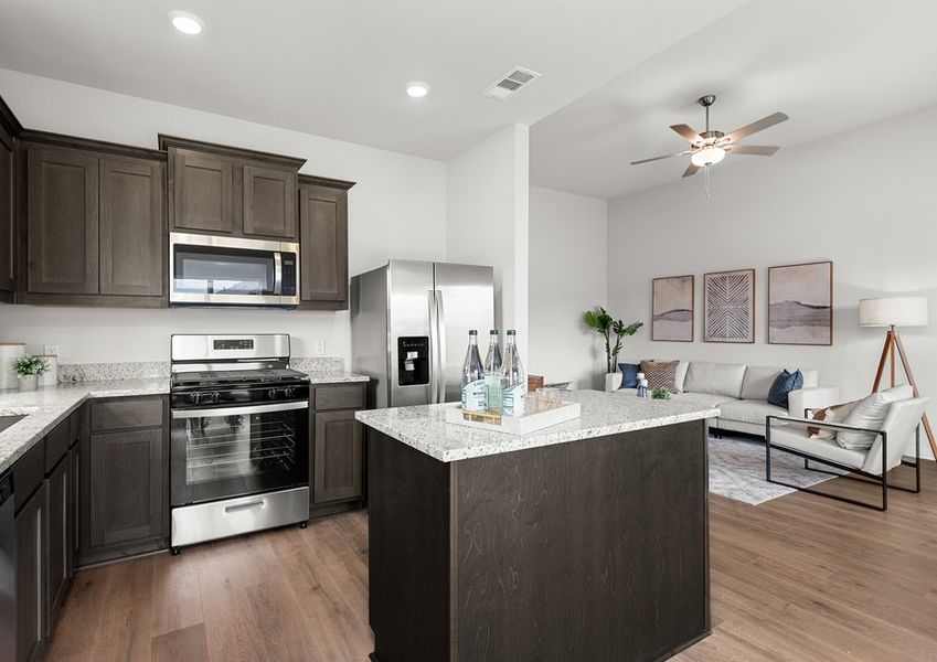 The family room sits right off of the kitchen. The family room sits right off of the kitchen.