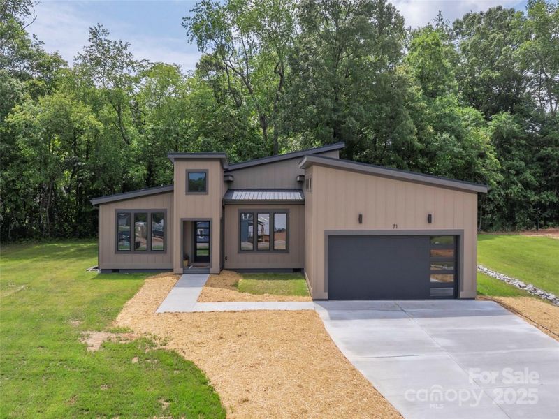 Front exterior of a new home in , Asheville, NC, highlighting curb appeal (Image 23). Front exterior of a new home in , Asheville, NC, highlighting curb appeal (Image 23).