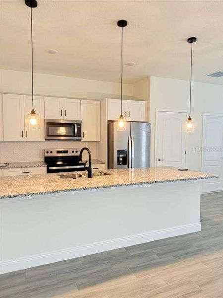 Furnished interior view inside a new home in , Poinciana (Image 3). Furnished interior view inside a new home in , Poinciana (Image 3).