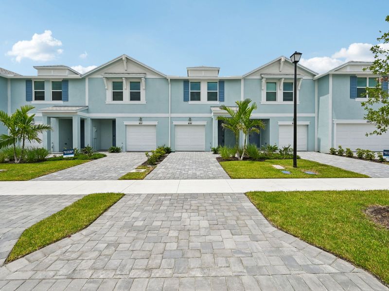 Front exterior of a new home in Tidewater, Fort Pierce, FL, highlighting curb appeal (Image 16). Front exterior of a new home in Tidewater, Fort Pierce, FL, highlighting curb appeal (Image 16).