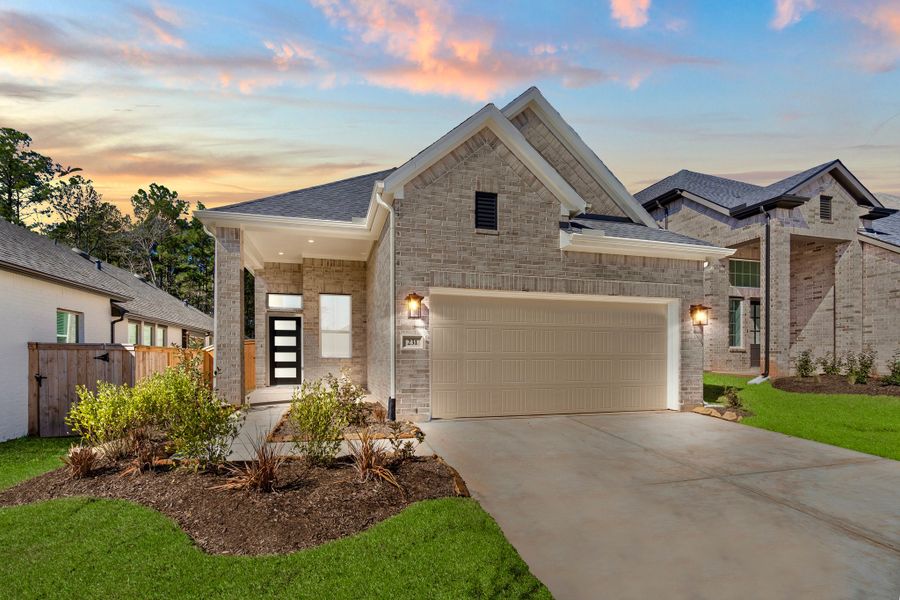 Front exterior of a new home in The Woodlands Hills, Willis, TX, highlighting curb appeal (Image 18). Front exterior of a new home in The Woodlands Hills, Willis, TX, highlighting curb appeal (Image 18).