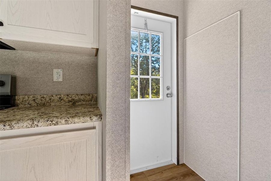 Exterior details and patio area of a home in , Williston (Image 19).