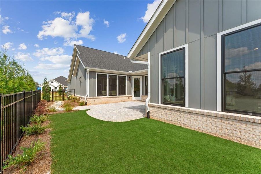 Exterior details and patio area of a home in The Courtyards of Franklin Goldmine, Cumming (Image 4).